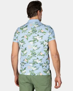 Pastellblaue Polo mit großem Blumenprint